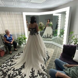 Only worn to try on one of a kind wedding dress . Bustle is set up as well.